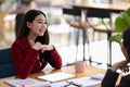 Businesswoman working with her colleague in modern office. Royalty Free Stock Photo