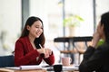 Businesswoman working with her colleague in office. Royalty Free Stock Photo