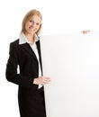 Cheerful businesswomen presenting empty board Royalty Free Stock Photo