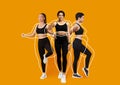 Cheerful calm slim different young female athletes in black sportswear, overweight ladies drawn around, enjoy exercises