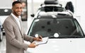 Cheerful Car Sales Manager Standing Near Auto In Store