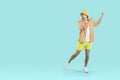 Cheerful carefree young man in summer clothes having fun on light blue background. Royalty Free Stock Photo