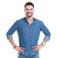 Cheerful casual man holding both hands on his waist Royalty Free Stock Photo