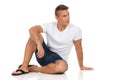 Cheerful Casual Man In White Shirt Sitting On Floor Royalty Free Stock Photo