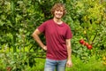 Cheerful Caucasian gardener working in the garden