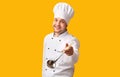 Cheerful Chef Holding Ladle Spoon Posing Over Yellow Background