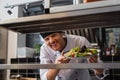 cheerful chef holding plate with freshly Royalty Free Stock Photo