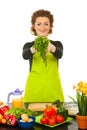 Cheerful chef woman giving herbs
