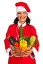 Cheerful chef woman with vegetables