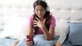 cheerful child blogger making video for weblog in headphones at home, conversation