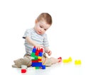 Cheerful child boy playing with construction set Royalty Free Stock Photo