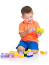 Cheerful child boy playing with construction set over white Royalty Free Stock Photo