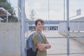 Cheerful child carrying his backpack