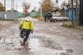 A child runs through a puddle. Children& x27;s clothing