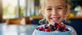 Cheerful Child Enjoying A Nutritious Breakfast Of Oatmeal Porridge With Fresh Berries