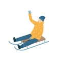 Cheerful child sledding down the hill. Boy rides on a sled