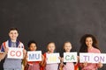 Cheerful children holding communication inscription