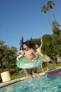 Cheerful Children Jumping Into Swimming Pool Royalty Free Stock Photo