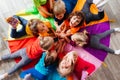 Cheerful children playing team building games on a floor Royalty Free Stock Photo