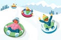 Cheerful children slide down the snow tubing hill