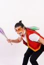 Cheerful circus performer skillfully juggling a number of clubs isolated on white background Royalty Free Stock Photo