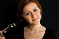 Cheerful clarinetist woman