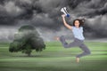 Cheerful classy businesswoman jumping while holding megaphone Royalty Free Stock Photo