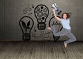 Cheerful classy businesswoman jumping while holding megaphone Royalty Free Stock Photo
