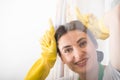 Cheerful cleaning woman acting funny