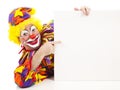 Cheerful Clown Points at Sign Royalty Free Stock Photo