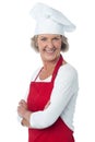 Cheerful confident aged female chef