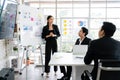 A cheerful and confident Asian businesswoman stands. Royalty Free Stock Photo