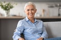 cheerful confident caucasian mature lady with short hair posing indoor Royalty Free Stock Photo