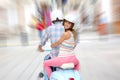 Cheerful coupl riding blue retro scooter Royalty Free Stock Photo