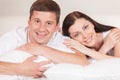 Cheerful couple awaking and lying happy. Royalty Free Stock Photo