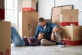 Woman lying on man lap after moving house Royalty Free Stock Photo