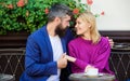 Cheerful couple. Couple in love on romantic date. First meet of girl and mature man. Brutal bearded hipster and girl