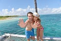 Cheerful couple on the deck of sailing boat in caribbean sea