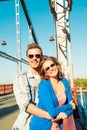 Cheerful couple embracing each other on the bridge Royalty Free Stock Photo