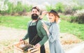 Cheerful couple of farmers standing in vegetable garden. Smile Couple on farmland. I like spending time on farm. Crop