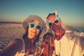 Cheerful couple, in funny sunglasses, with a small dog Royalty Free Stock Photo