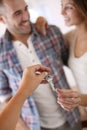 Cheerful couple receiving keys of their new apartment Royalty Free Stock Photo