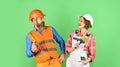 Cheerful couple renovating house. Woman builder hard hat. Man engineer or architect. Interior renovation. Family nest