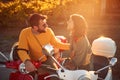 Cheerful couple riding a scooter and having fun Royalty Free Stock Photo