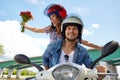 Cheerful couple riding vintage scooter. Royalty Free Stock Photo