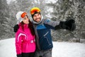 cheerful couple snowboarder enjoying at ski resort in the mountain Royalty Free Stock Photo
