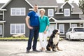A Cheerful couple standing in front of new house Royalty Free Stock Photo