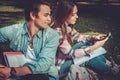 Cheerful couple with studying in green park Royalty Free Stock Photo