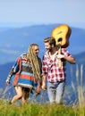 Cheerful couple. western camping. hiking. friendship. campfire songs. men play guitar for girl. happy friends with Royalty Free Stock Photo