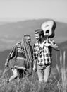 Cheerful couple. western camping. hiking. friendship. campfire songs. men play guitar for girl. happy friends with Royalty Free Stock Photo